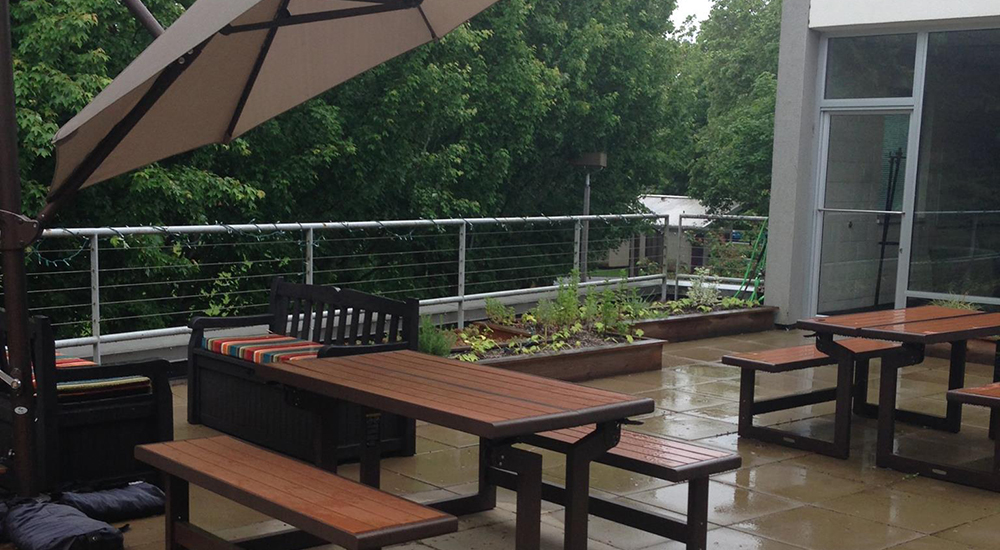 Self Enhancement, Inc. rooftop patio with garden beds